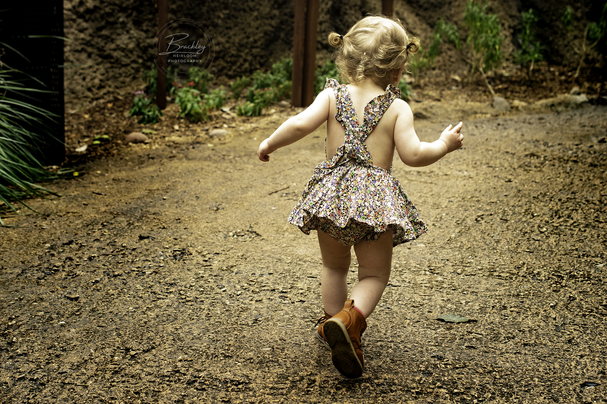 Little Girl Running at San Antonio Zoo in Pinafore Dress and Doc Martens